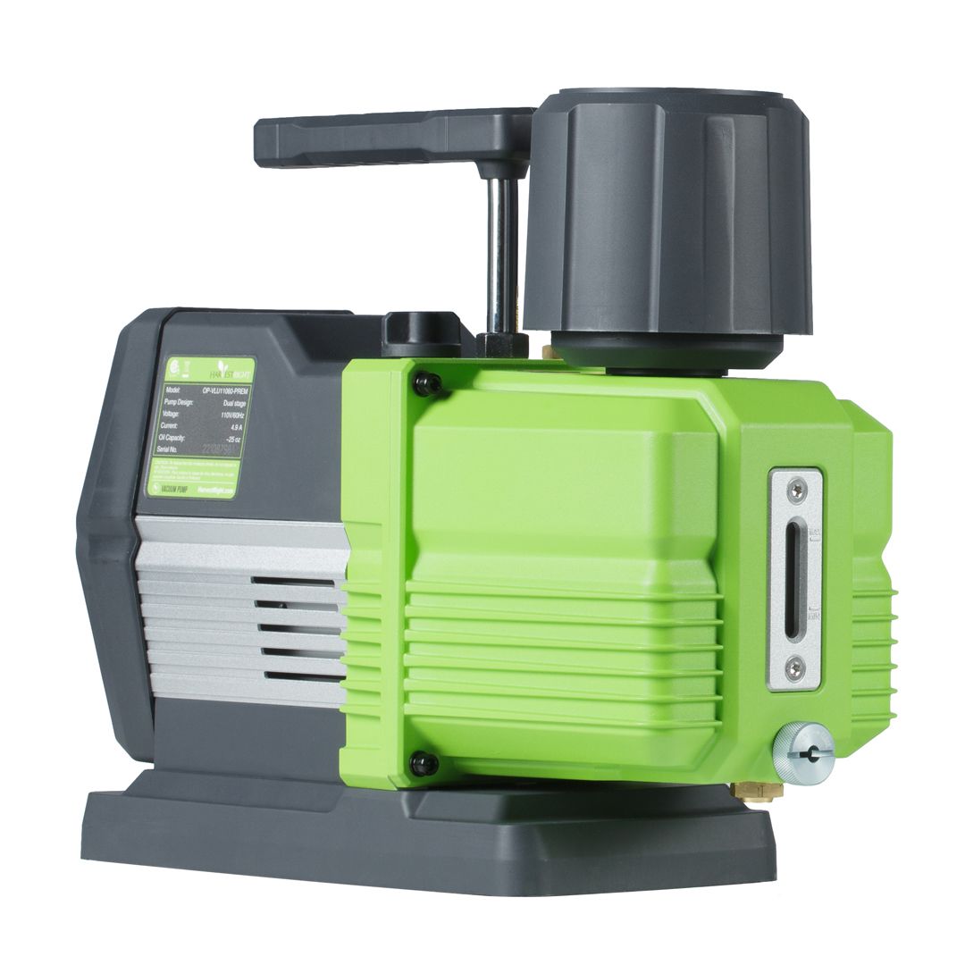A green and gray vacuum pump with a handle and oil sight glass.