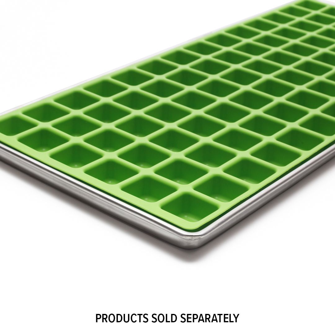 Green silicone ice cube tray with small, square molds in a stainless steel frame.