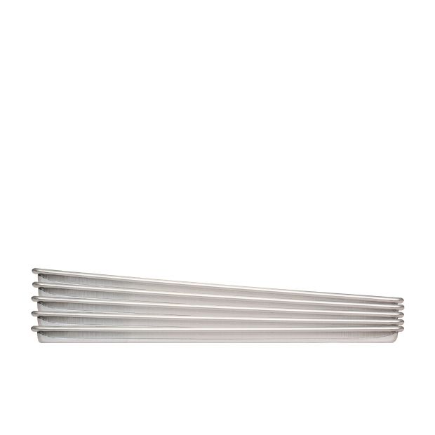 Silver, ribbed metal radiator, angled from left to right, against a white background.