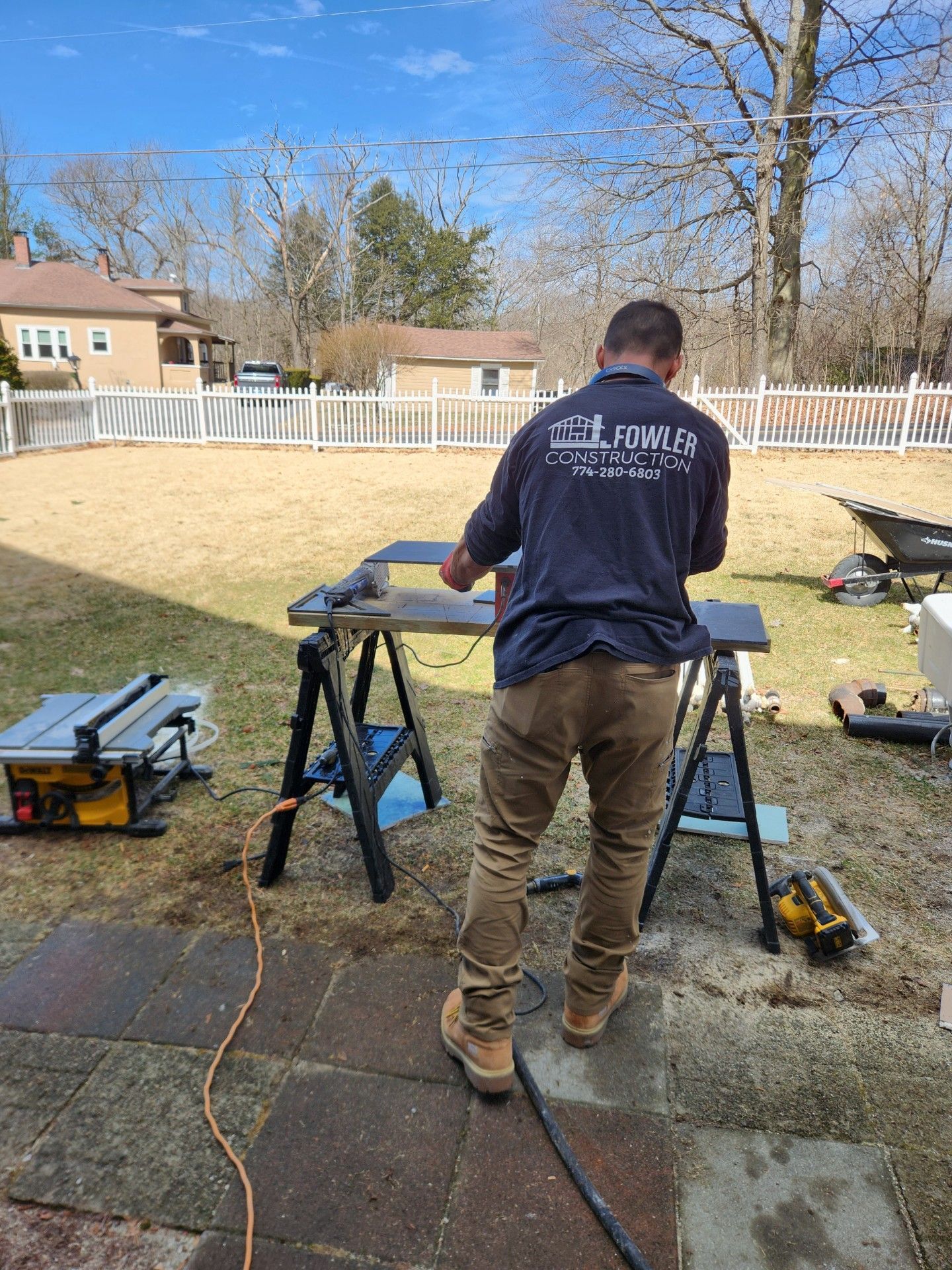 A house is being built with plywood walls and windows.