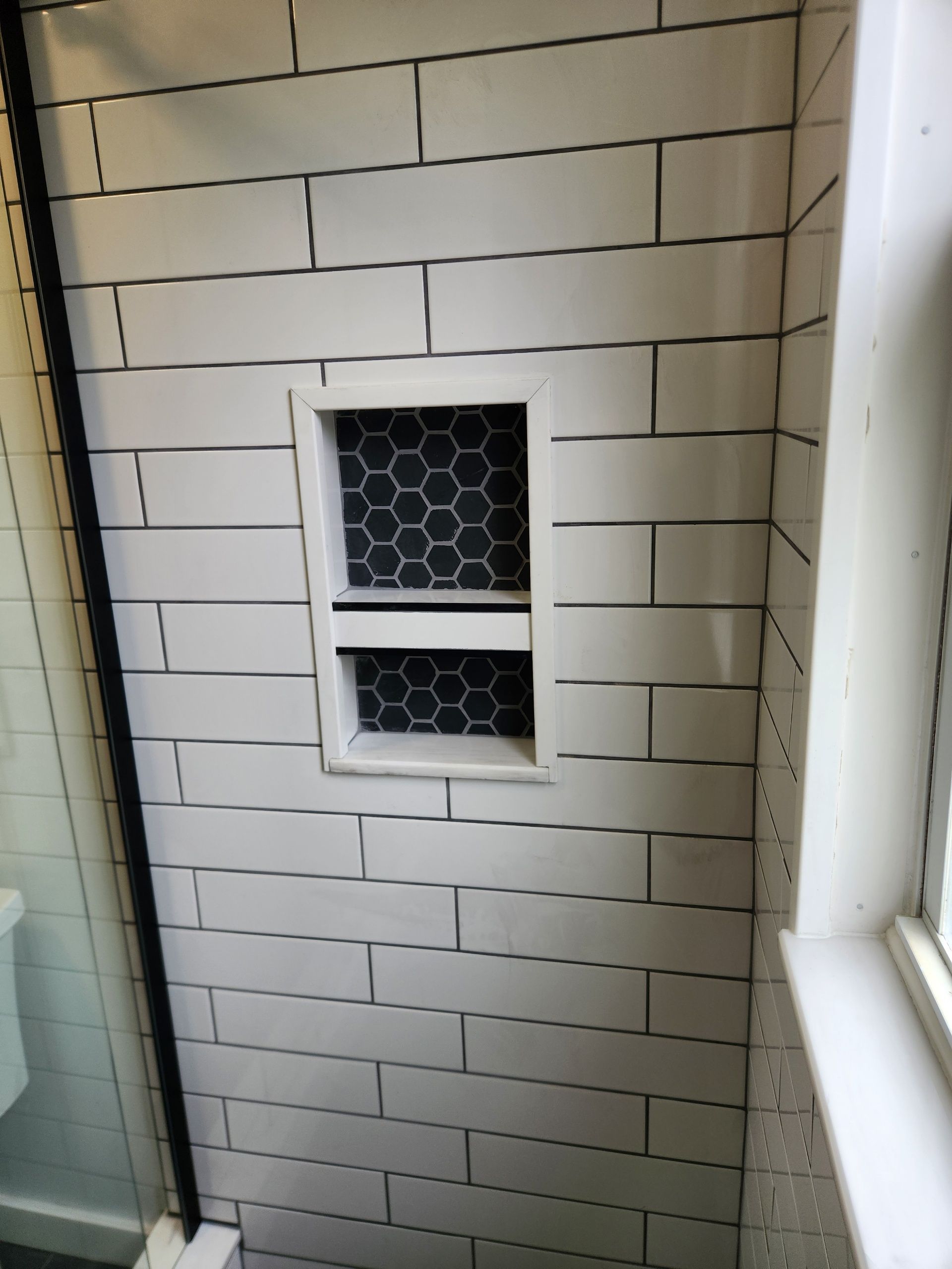 A bathroom with a tiled floor and a door.
