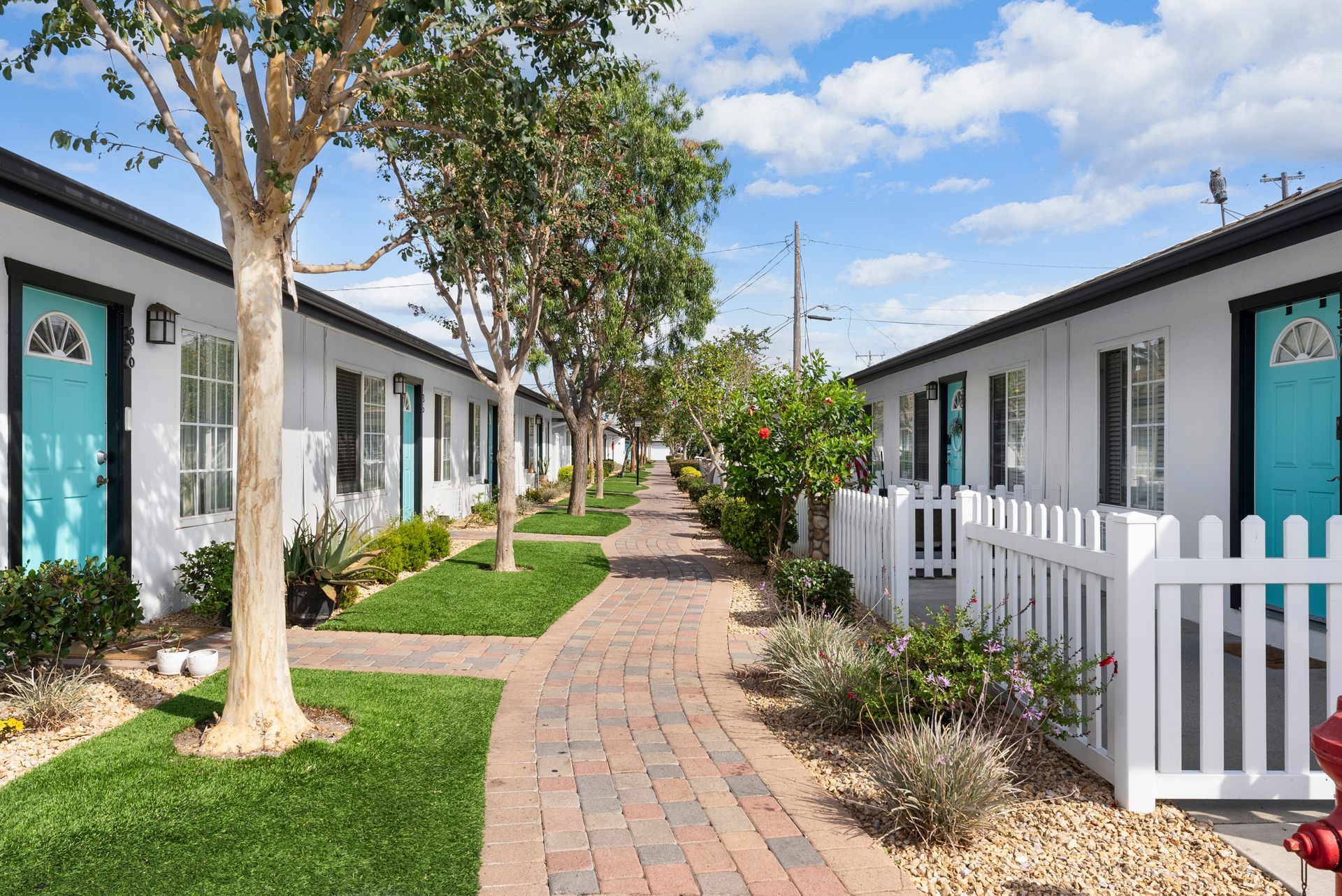 building exterior, path, and tree