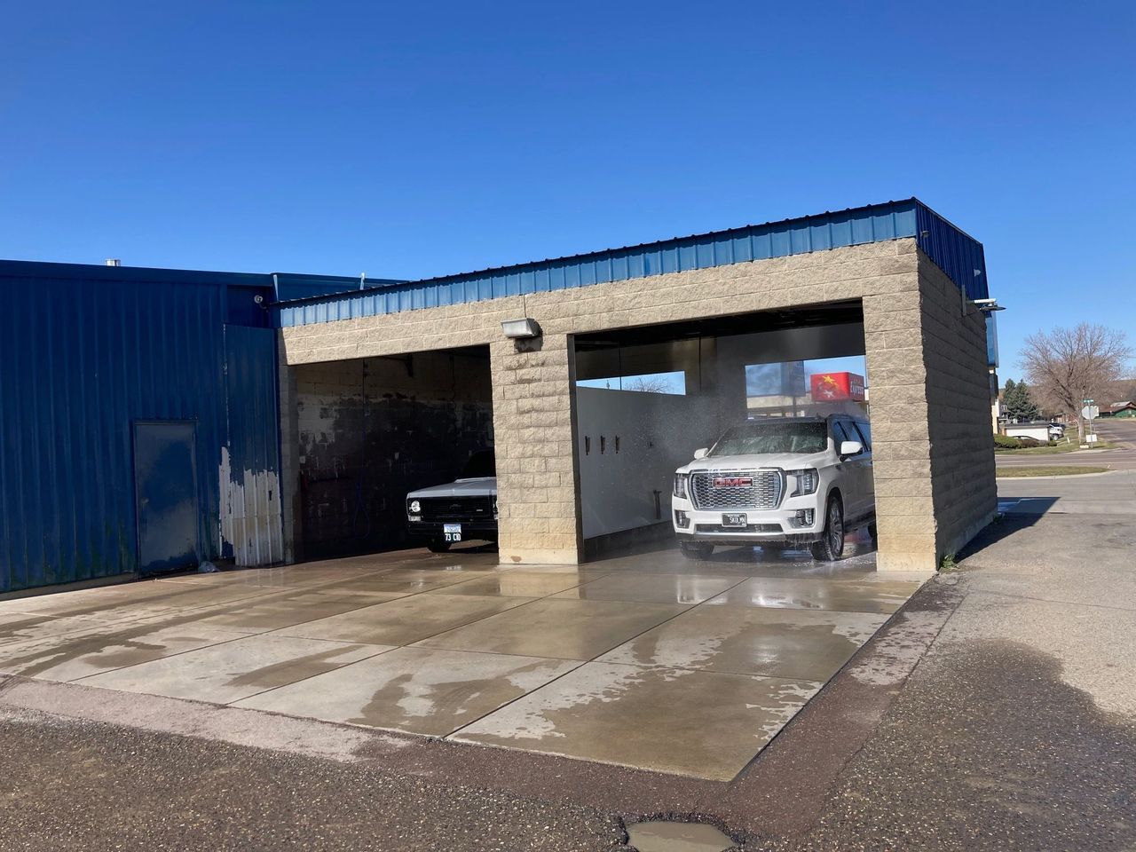 A car is being washed in a car wash.