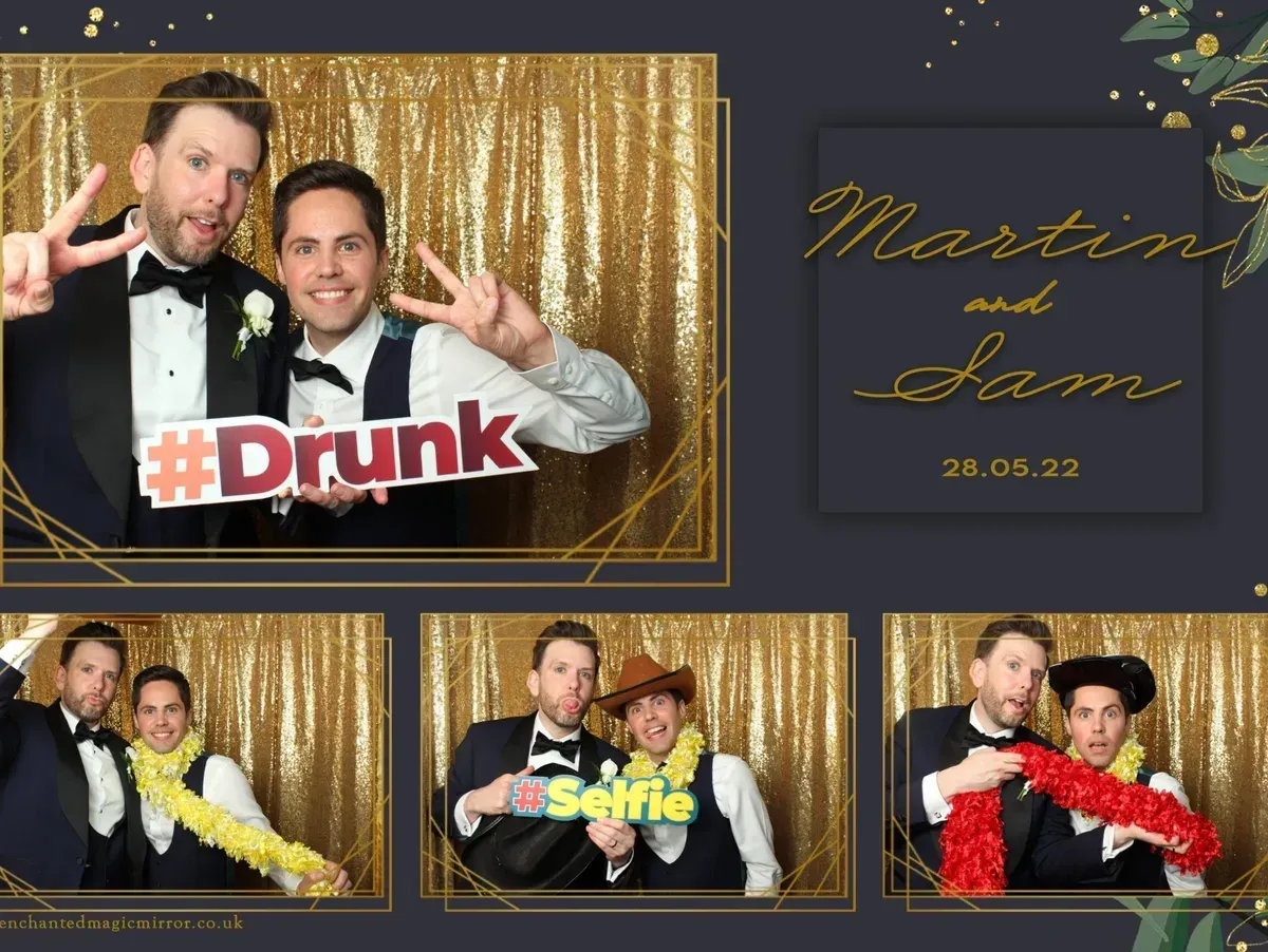 A group of men are posing for a picture in a photo booth.