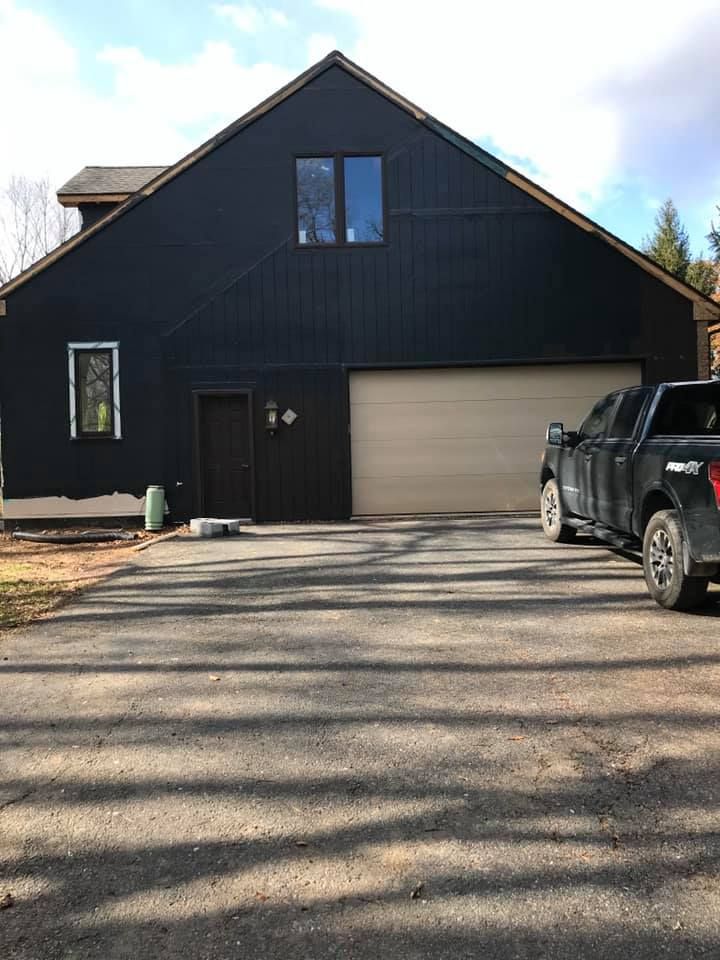 A Black Truck Parked in Front of a Black House - Whitehall, PA - Jimenez Contracting LLC