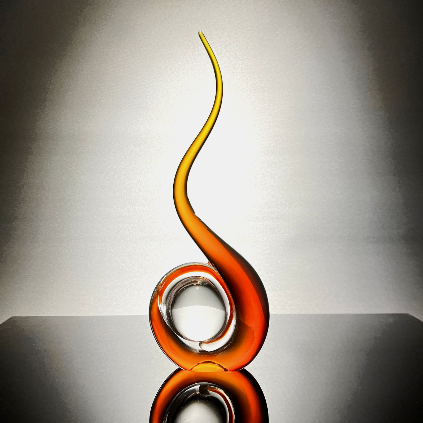 A white and blue swirl on a black surface