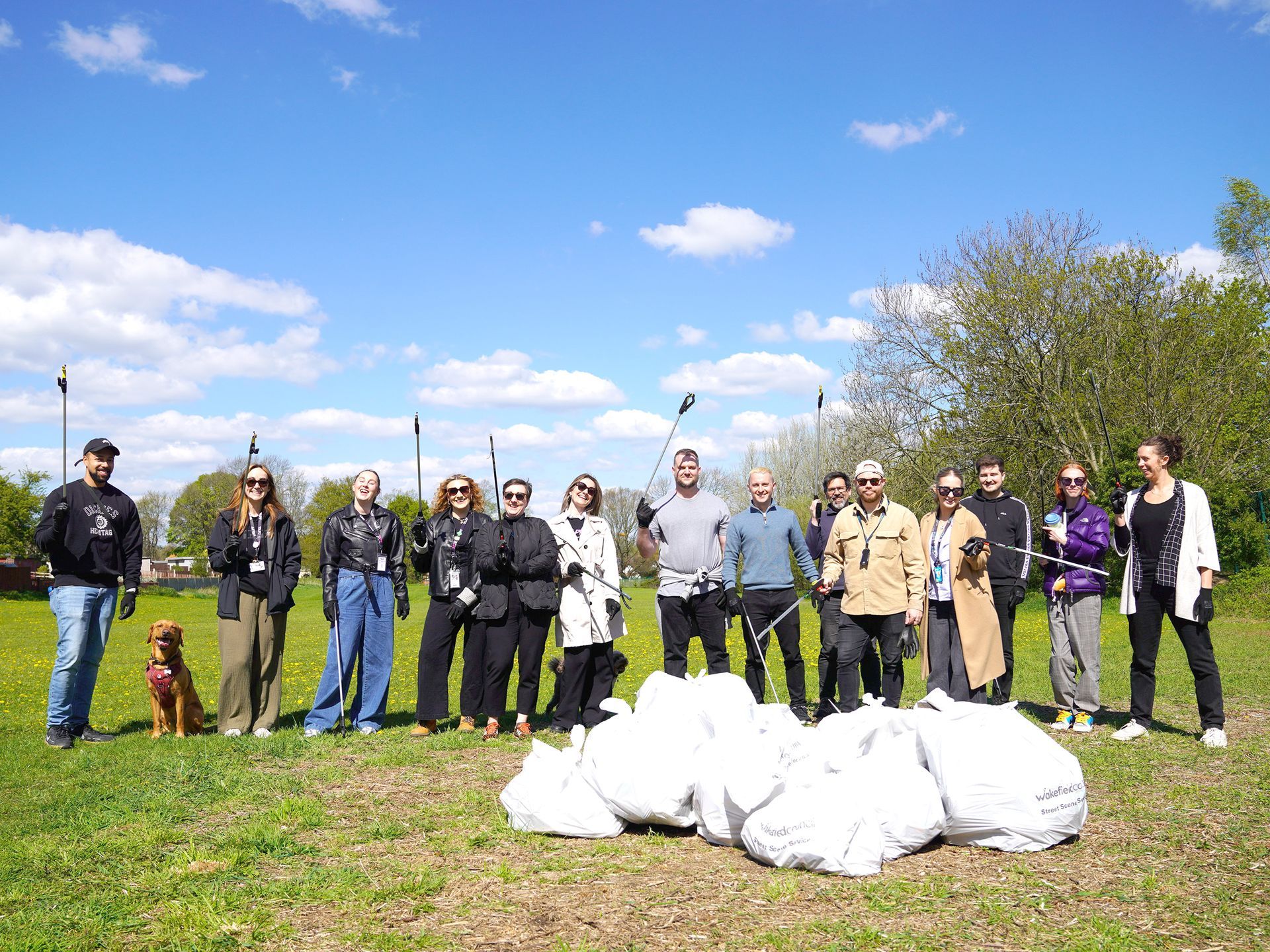 Happy staff celebrate after collecting litter from Langthwaite Business Park