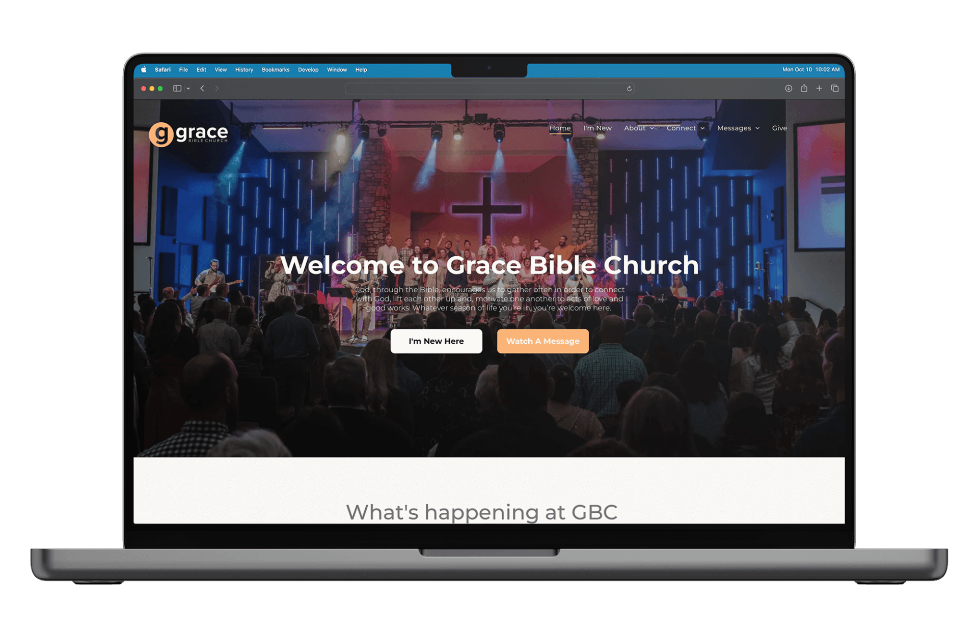 A laptop computer is open to a website for grace bible church.