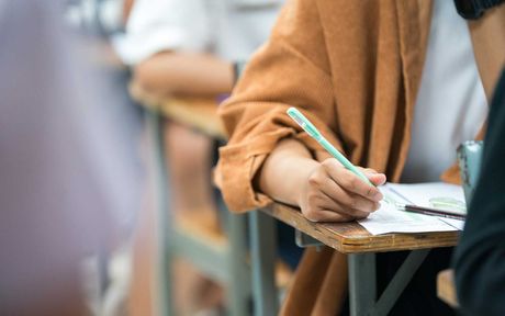 taking notes at classroom during a lesson,
