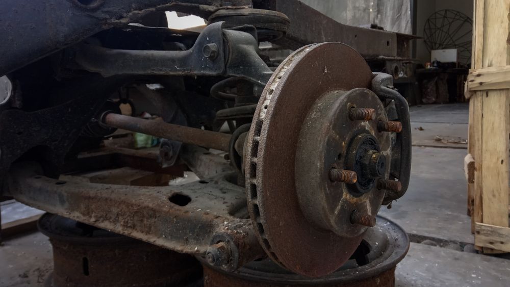 Rusty Car Suspension and Brake Assembly — Haigh Truck & 4WD Repairs In Orange, NSW