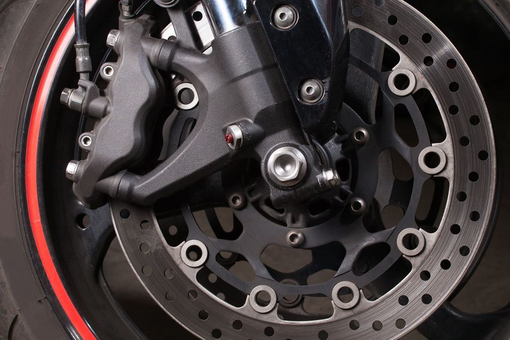Motorcycle Front Wheel with Black Brake Disc — Haigh Truck & 4WD Repairs In Orange, NSW