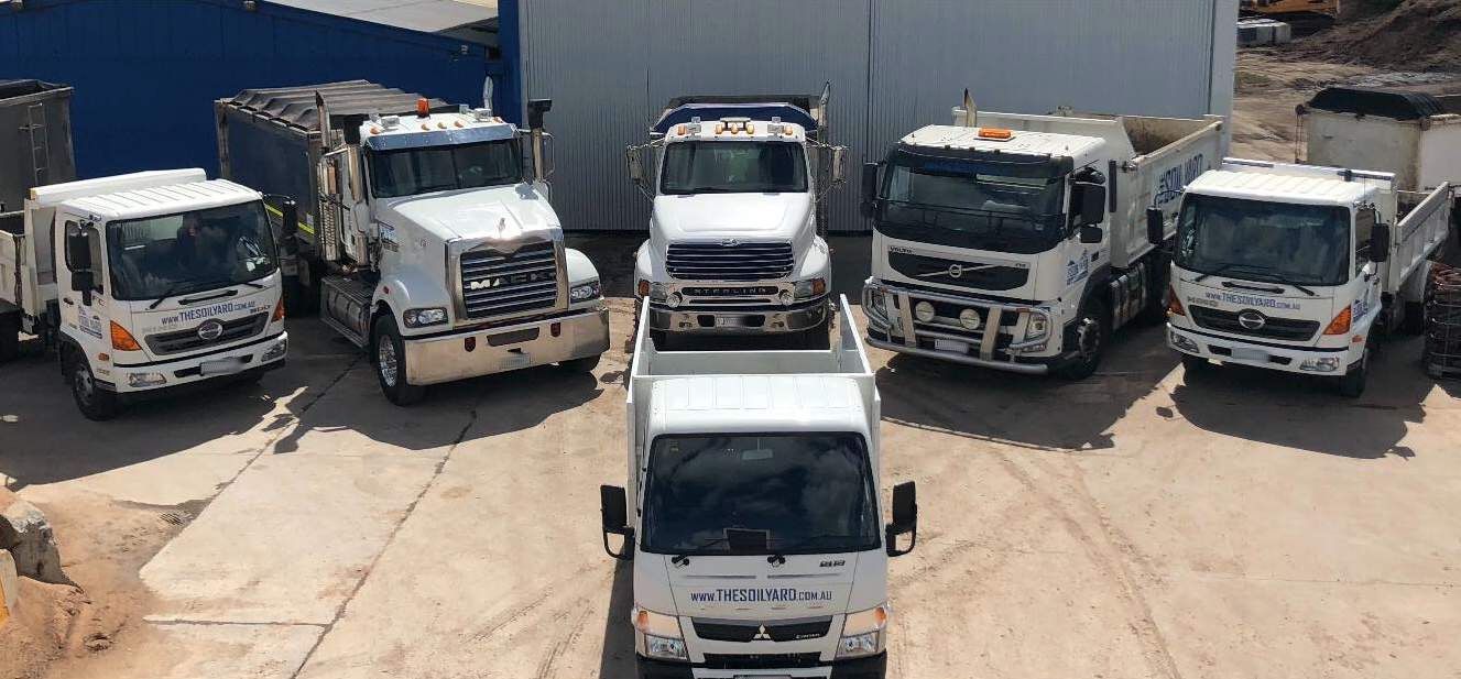 A Group of White Trucks Parked in a Lot — The Soil Yard in Delacombe, VIC
