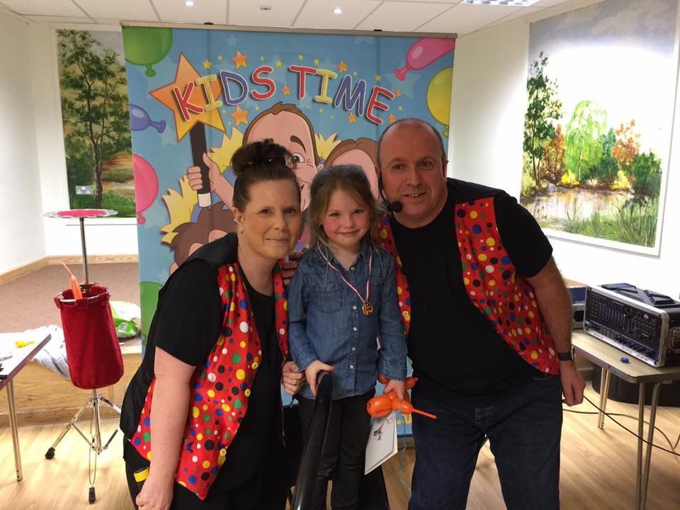 Little girl laughing with Derek and Suzanne