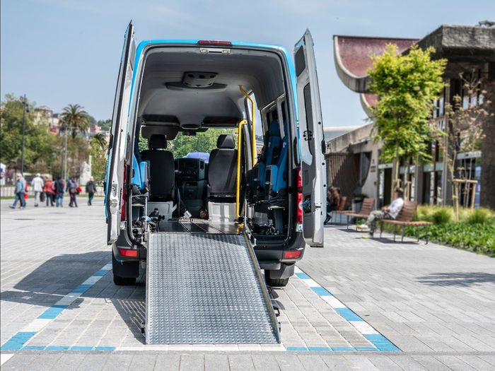 Van with a ramp for wheelchair transport