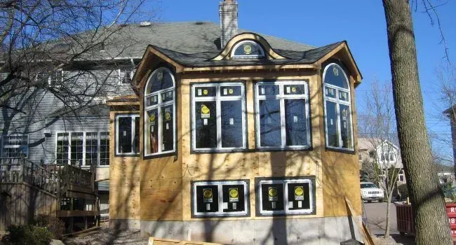 A bathroom with a sink a mirror and a toilet