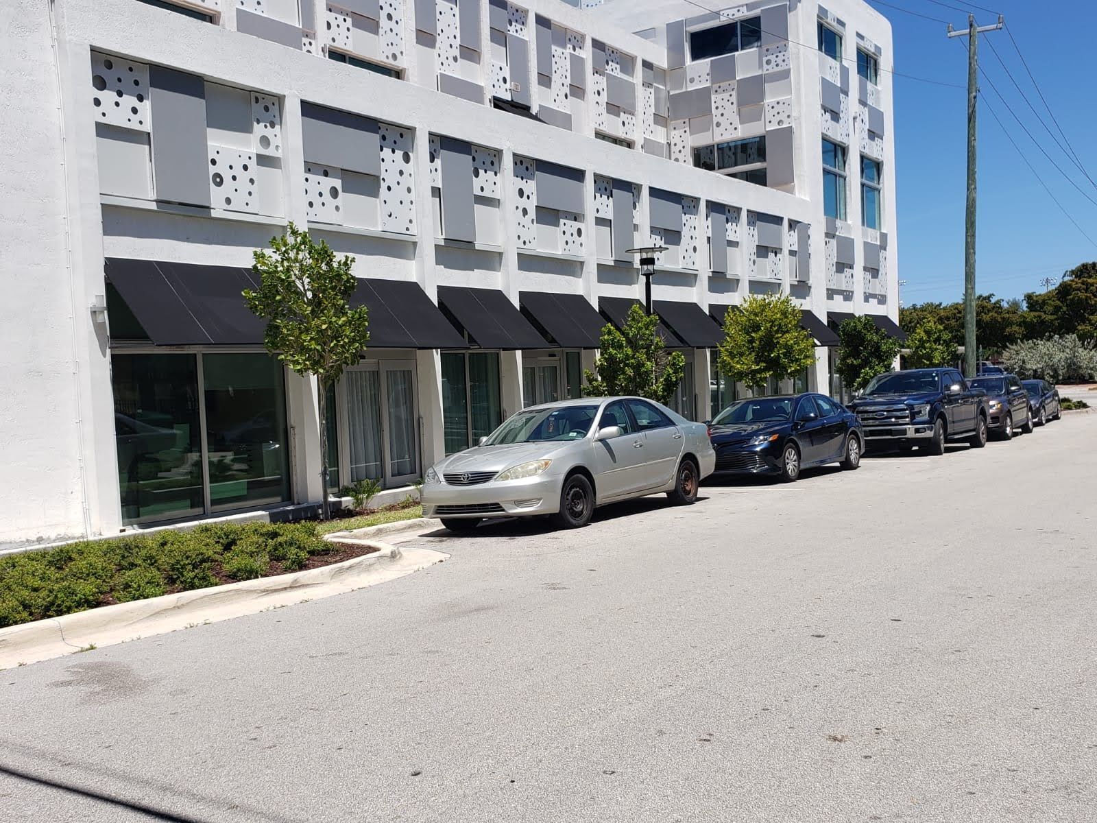 A red canopy on top of a building with a blue sky in the background.