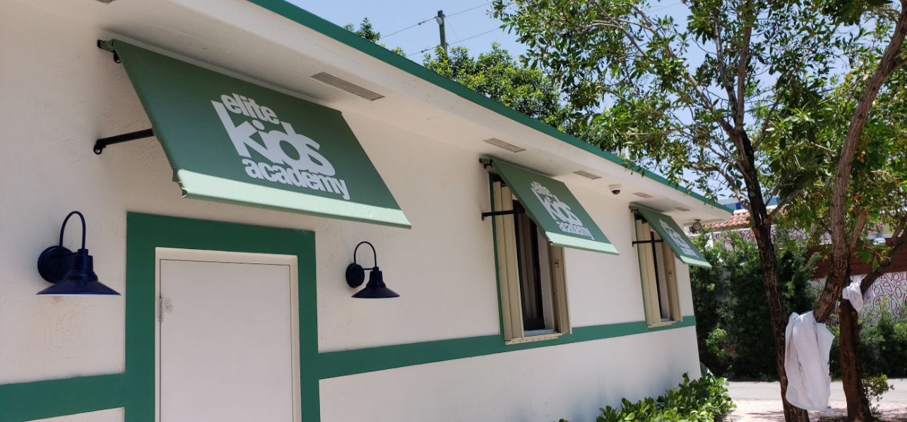 A window on a building with a canopy over it