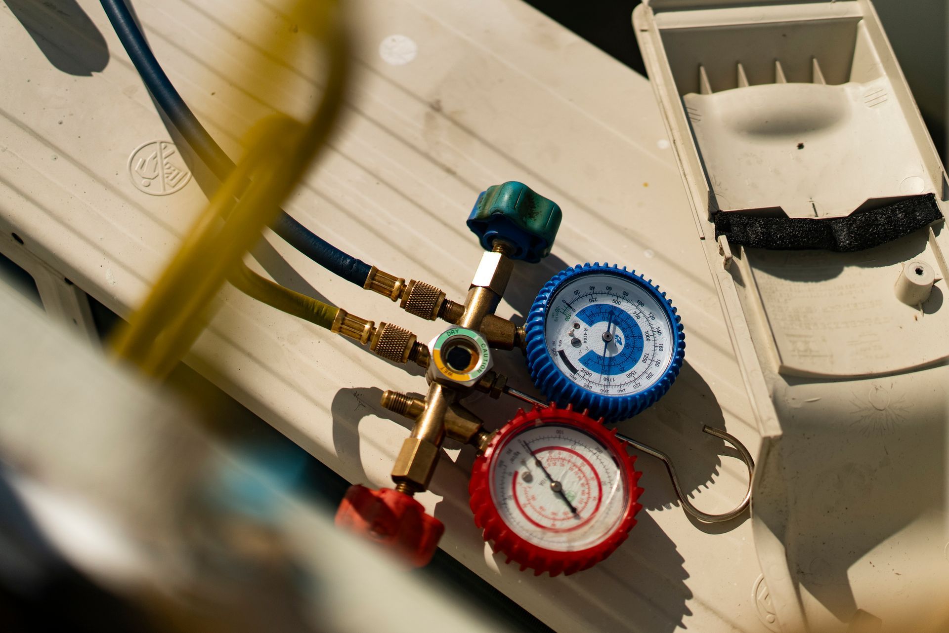 A close up of a couple of gauges on a table