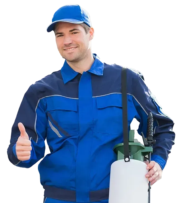 A man in a blue uniform is holding a sprayer and giving a thumbs up