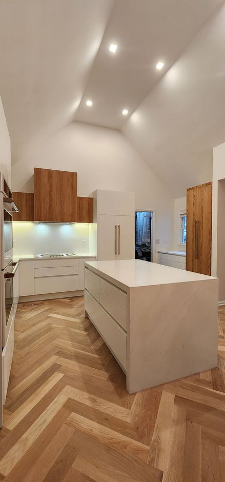 There is a large island in the middle of the kitchen.