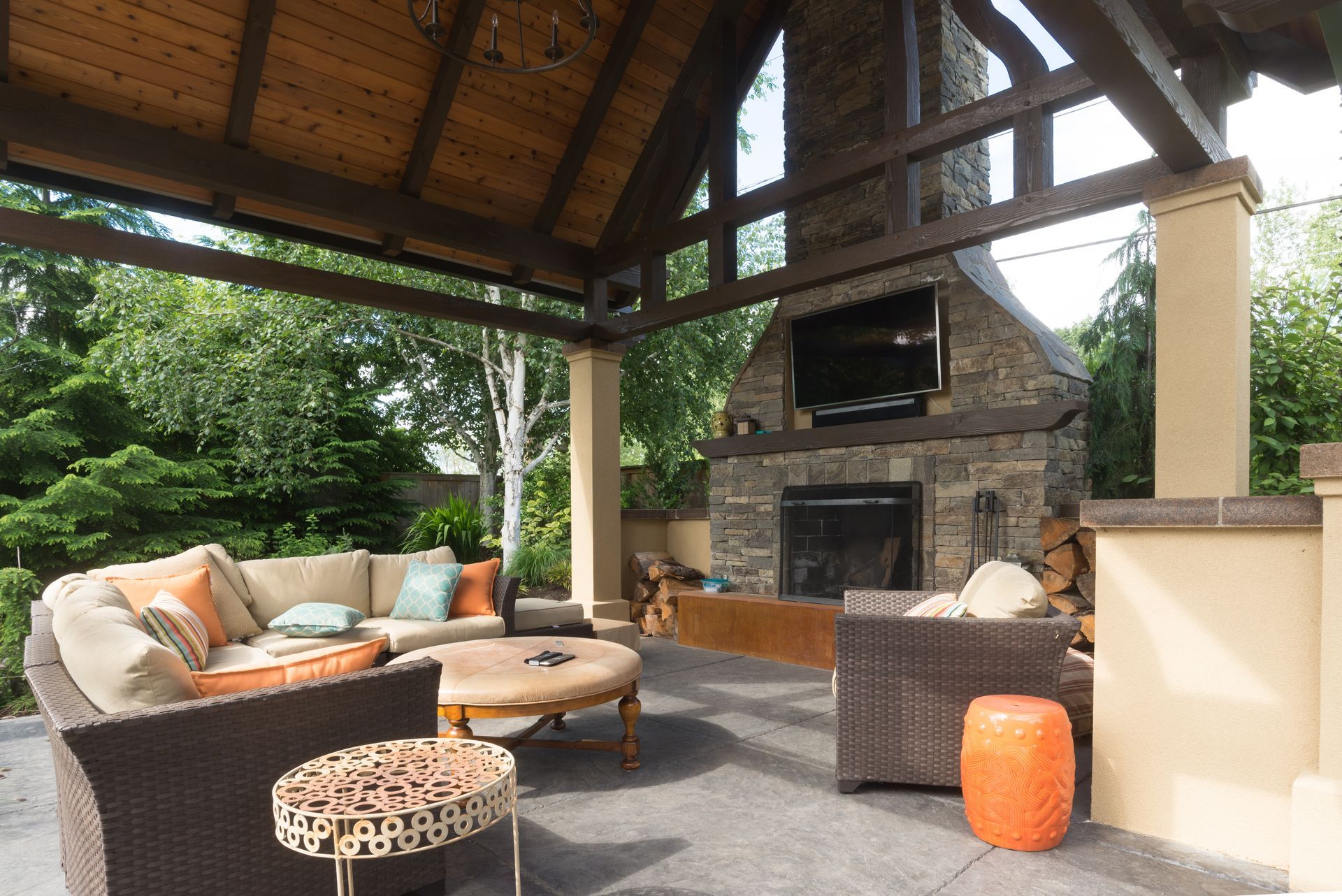 A patio area with a fireplace and a couch