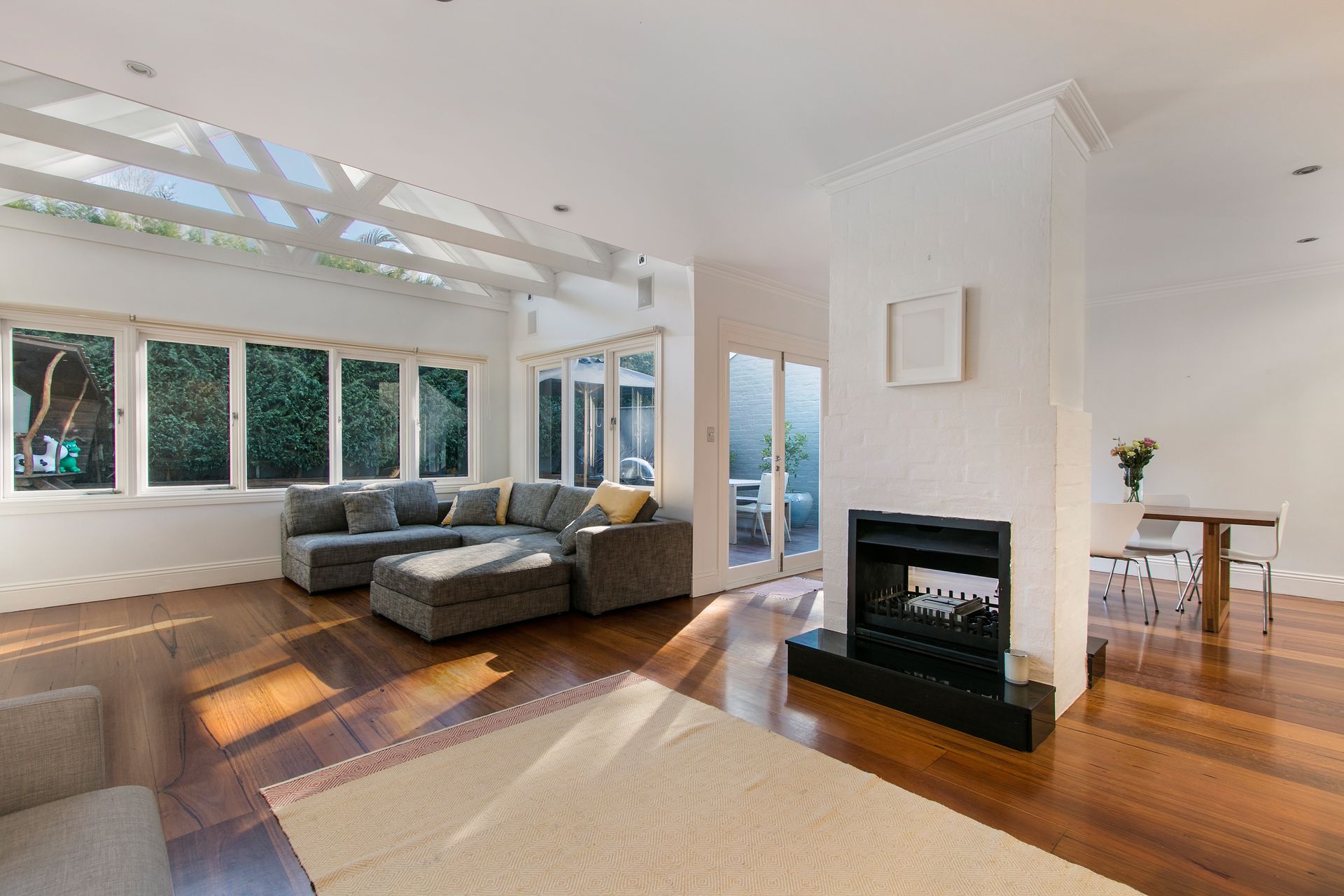 There is a fireplace in the middle of the living room.