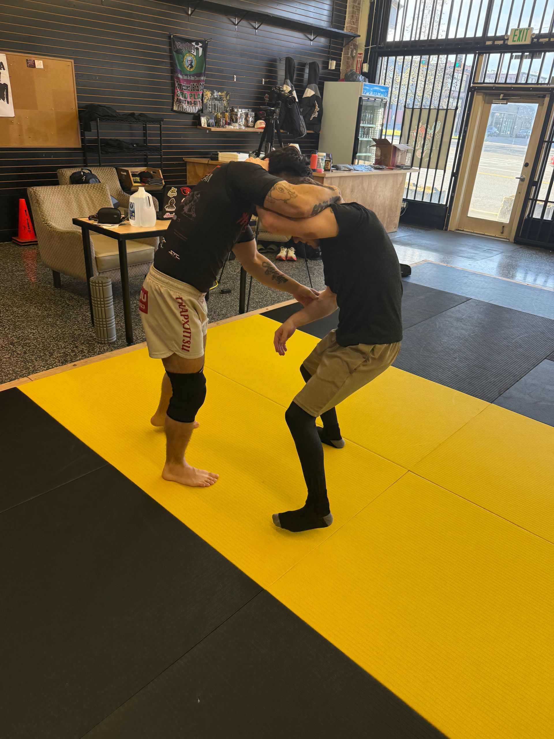 Beginners practice controlled Jiu-Jitsu drills at Mythic Martial Arts in Tacoma, WA.