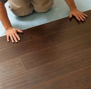 Man Installing Laminate Floor - Laminate in Jefferson, MA
