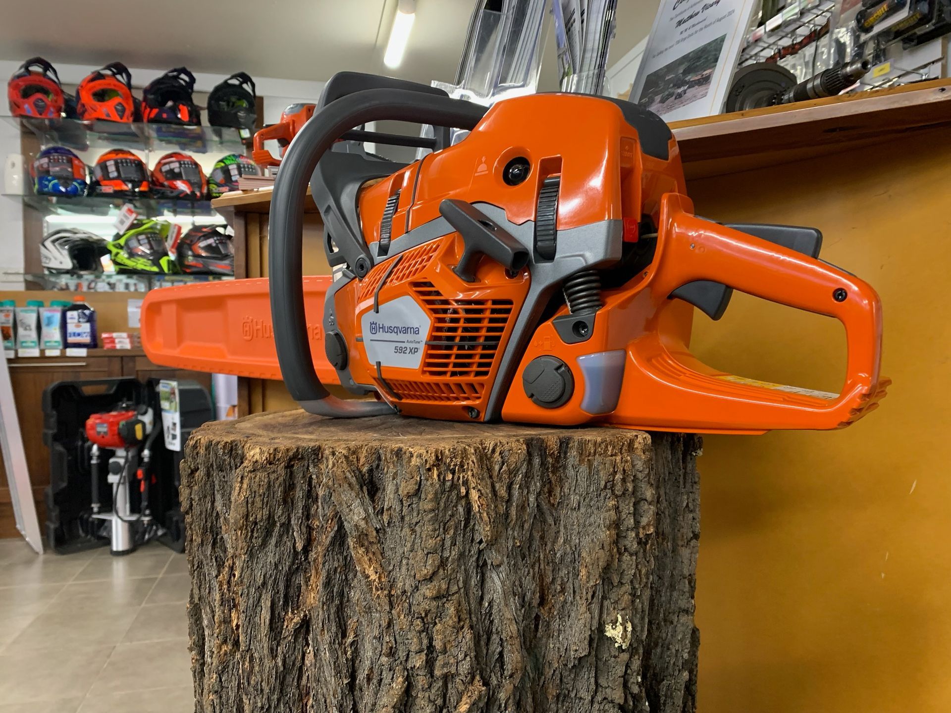 Three Orange Chainsaws on a Cardboard Box — M.M & Mechanical in Dubbo, NSW