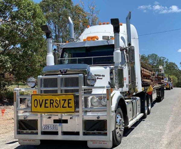 OVERSIZE sing on front of semi truck