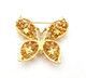 A gold brooch in the shape of a butterfly