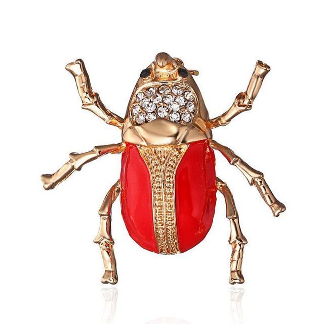 A close up of a bug sitting on top of a flower bed.