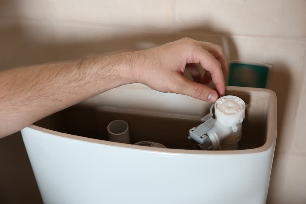 Repairing Toilet Tank — Mainline Plumbing & Civil Pty Ltd In Cobar, NSW