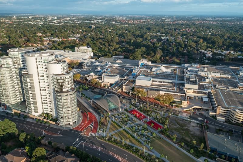 An Aerial View of a City With a Lot of Buildings and Trees — Mainline Plumbing & Civil Pty Ltd In Castle Hill, NSW