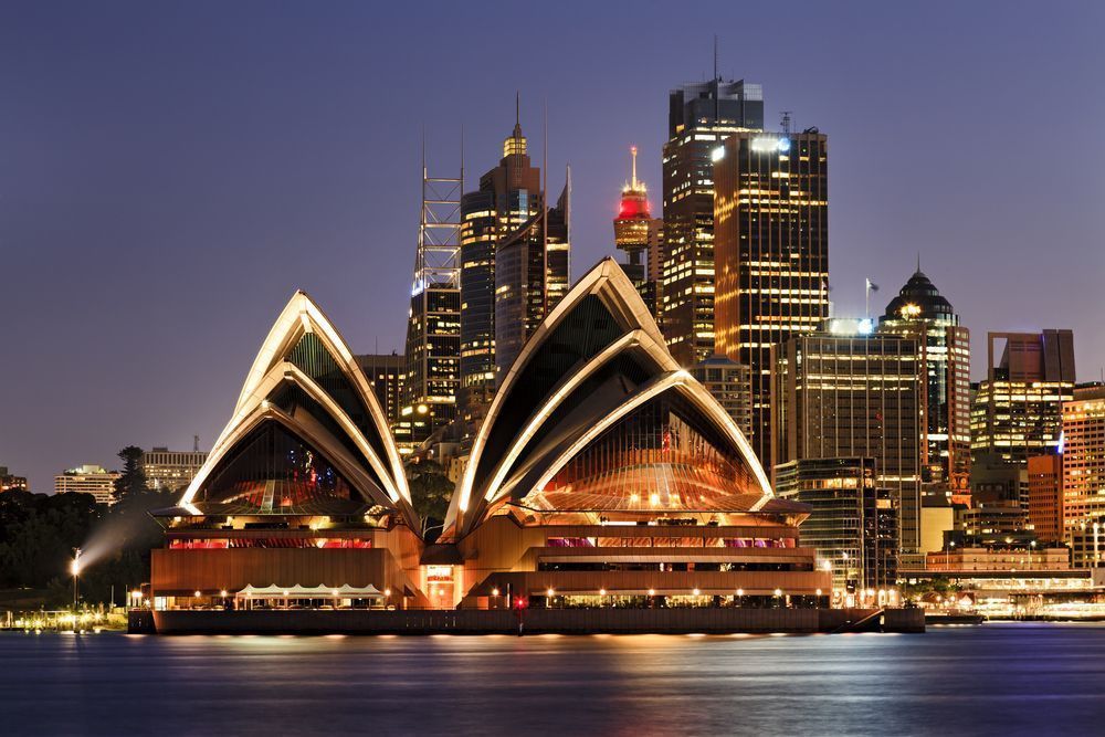 The Sydney Opera House is Lit Up at Night — Mainline Plumbing & Civil Pty Ltd In Sydney, NSW