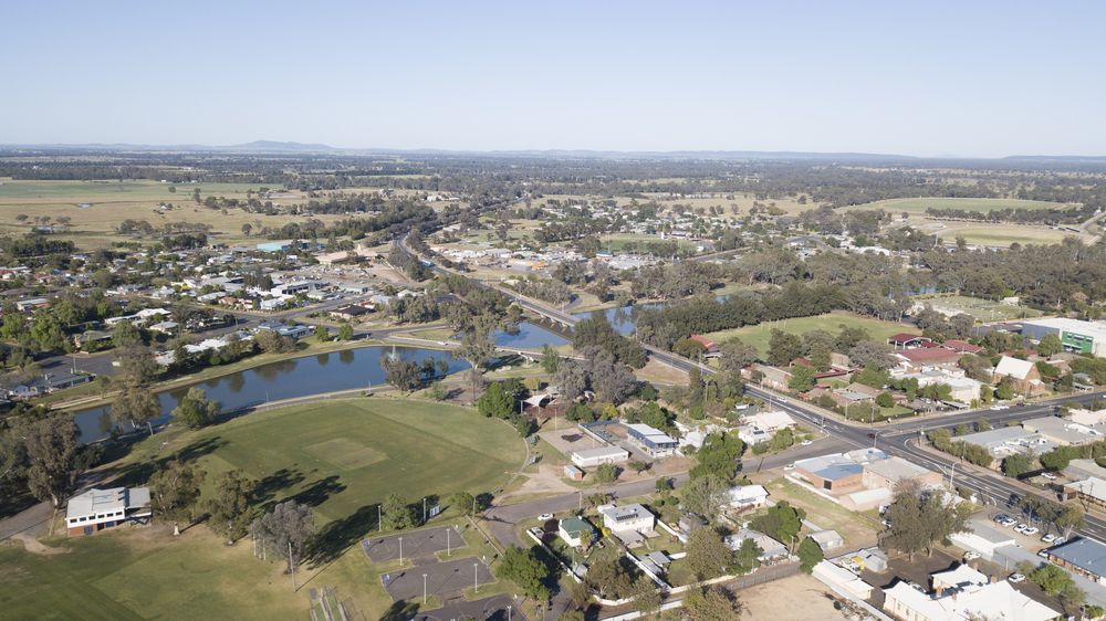 An Aerial View Of A Small Town With A Lake In The Middle Of It — Mainline Plumbing & Civil Pty Ltd In Forbes, NSW