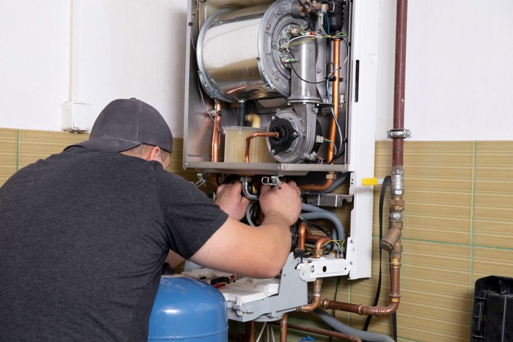 Gas Fitter Checking for Leaks