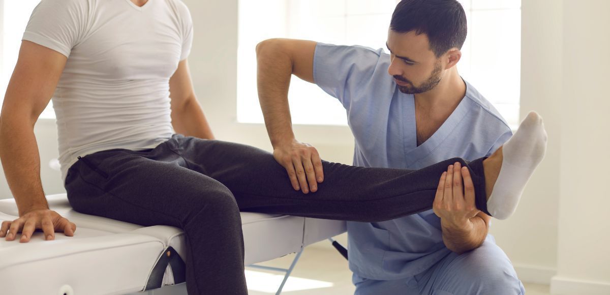 Nurse Practitioner doing a sports physical on a table in a bright clinic