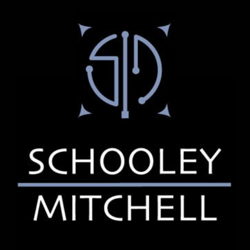 A logo for schooley mitchell on a black background