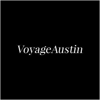 The logo for voyage austin is on a black background.