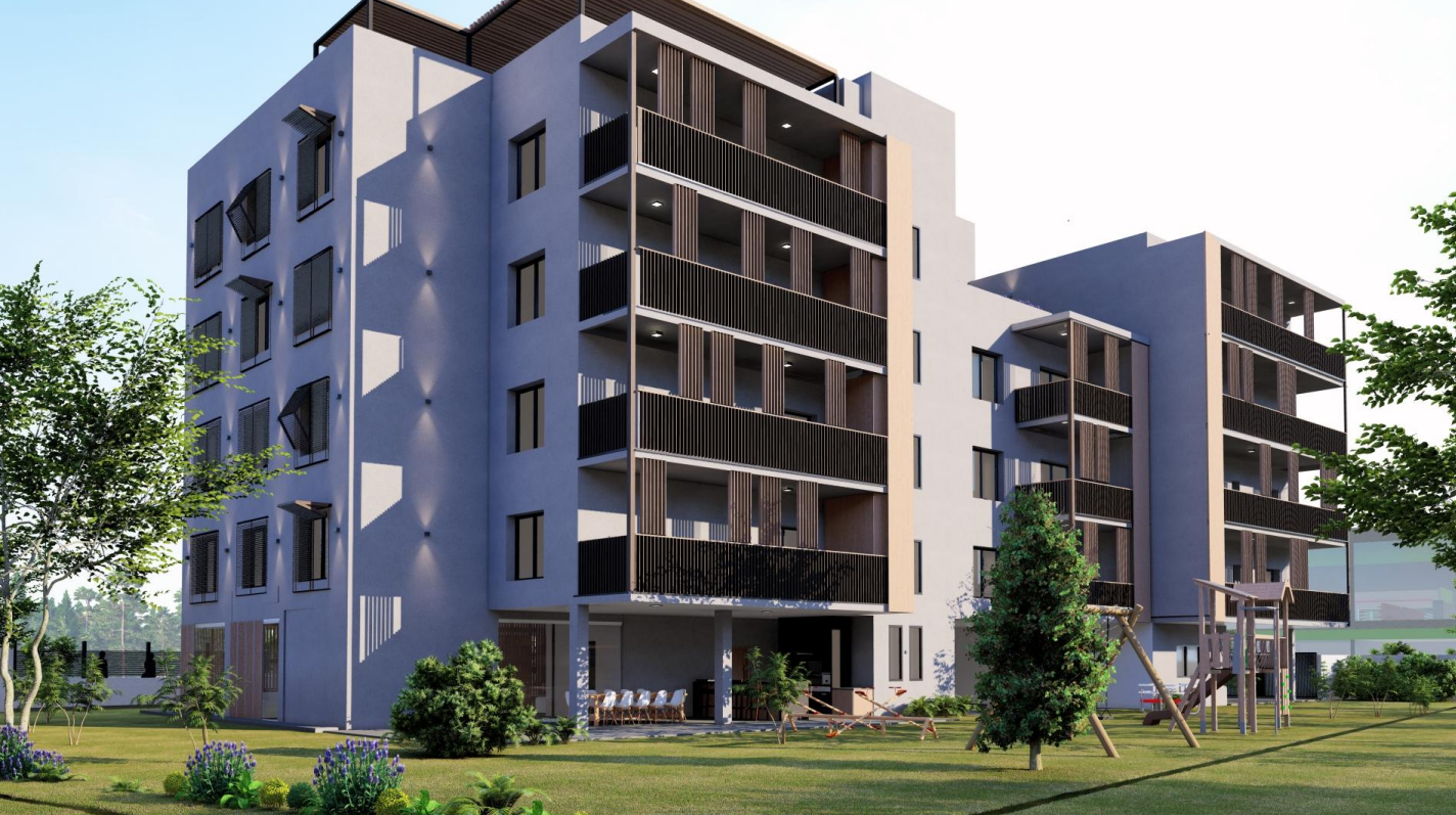 Moderno edificio de apartamentos de varios pisos con balcones, ubicado sobre un césped con árboles.