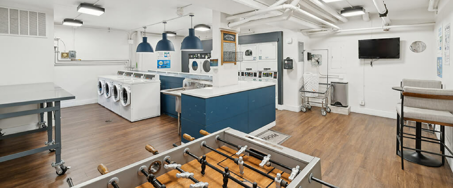 There is a foosball table in the middle of the room.