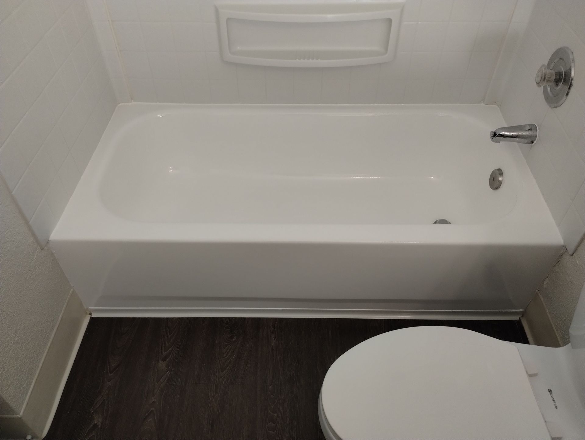 a bathtub with a shower attached to it