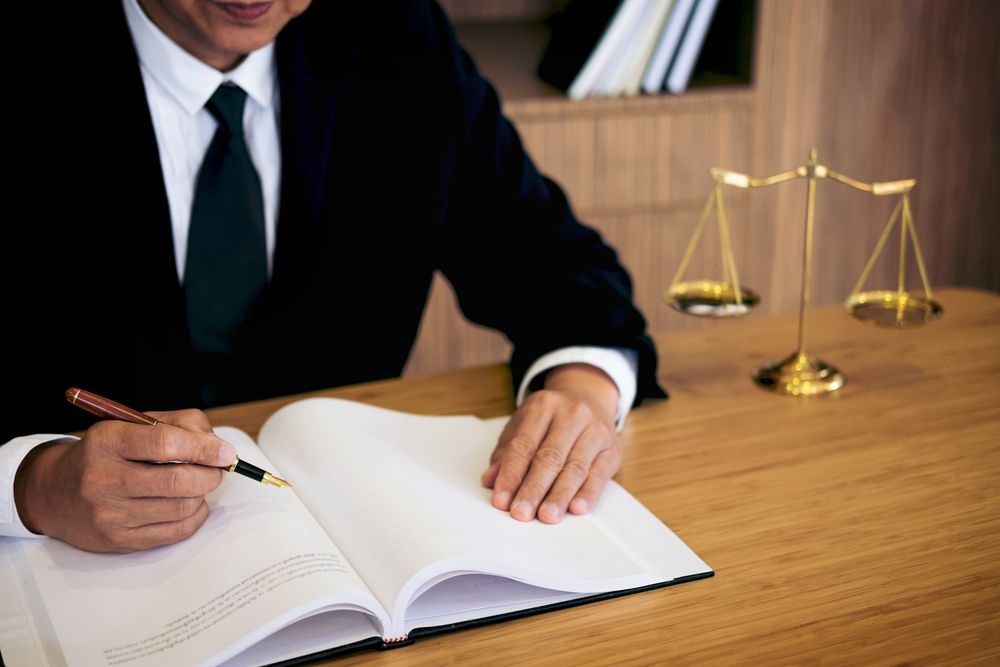 A Lawyer Writing Notes For A Case