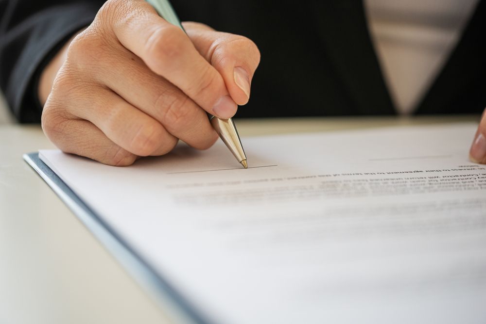 Criminal Lawyer Signing a Bail Document