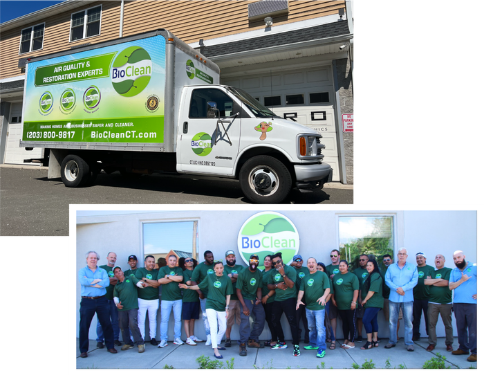 A group of people standing in front of a bio clean truck