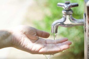 Woman Washing Hands — Lisle, IL – Jim Dhamer Plumbing and Sewer, Inc.