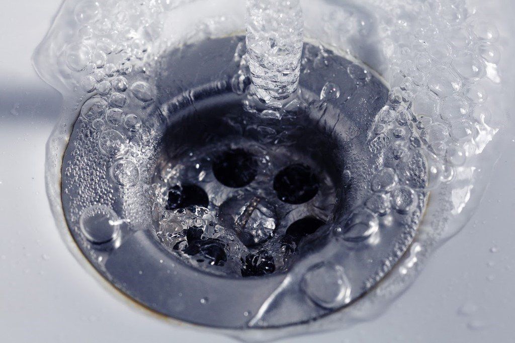 Kitchen Sink with Running Water — Elkhart, IN — Roto-Rooter Sewer - Drain Services