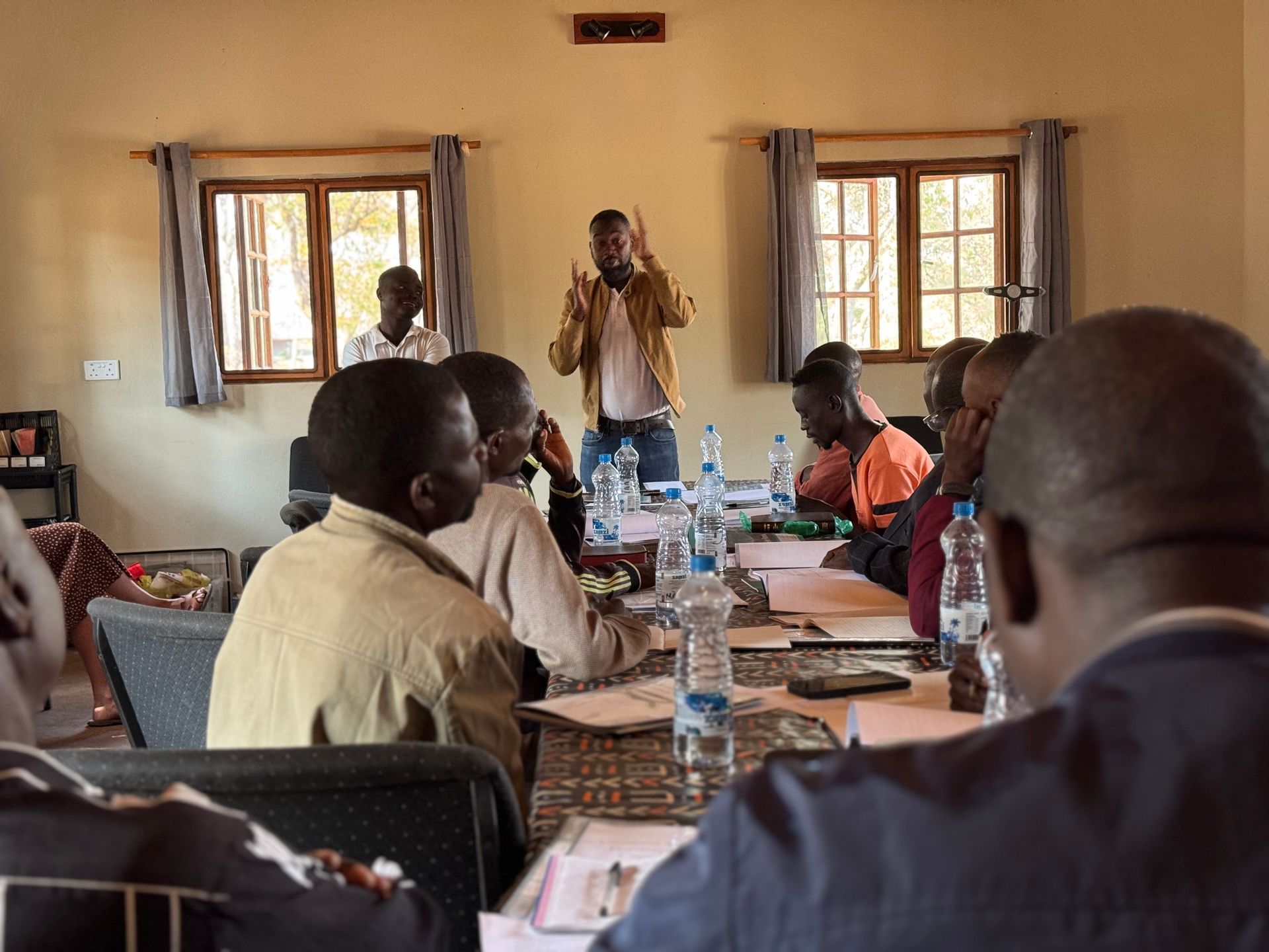 A man is giving a presentation to a group of people
