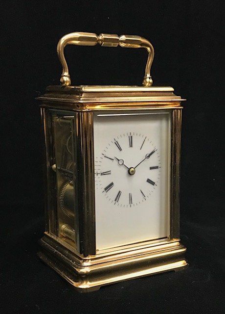 Carriage clock in gilt brass gorge case